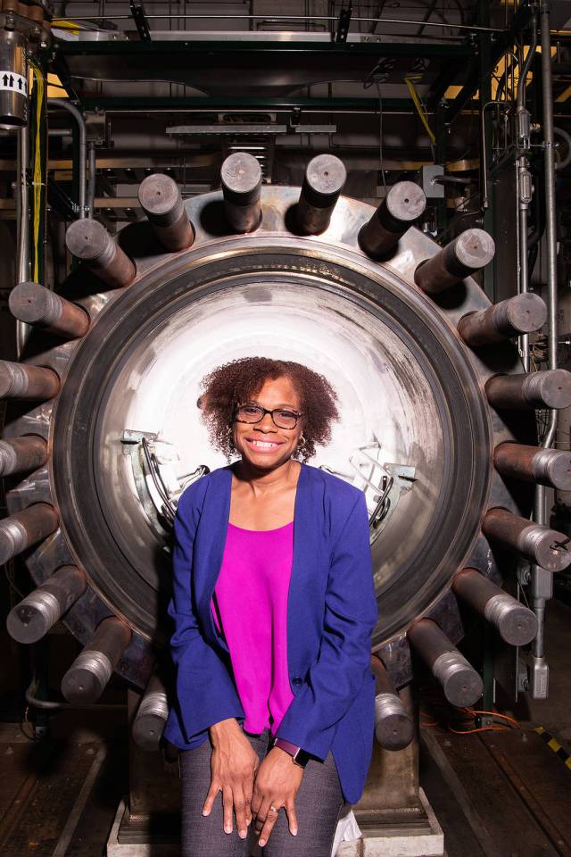 Concha Reid, deputy manager for the Space Science Project Office, in front of the Glenn Extreme Environments Rig at NASA’s Glenn Research Center. 