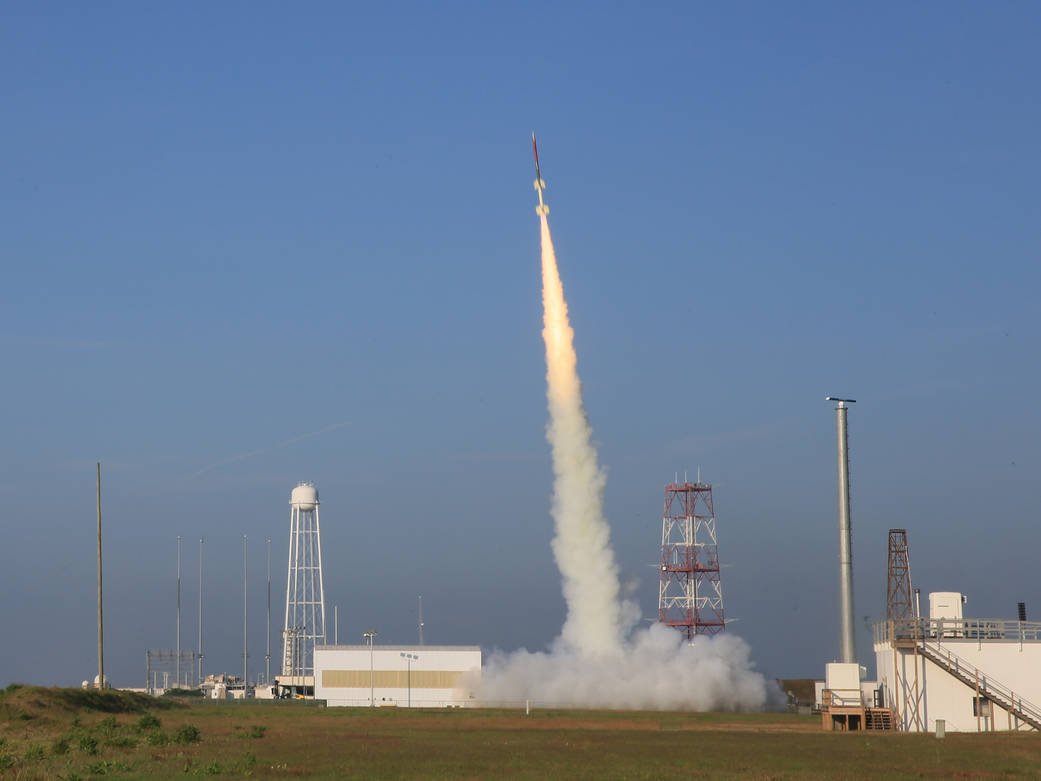 The RockOn sounding rocket climbs into the sky.