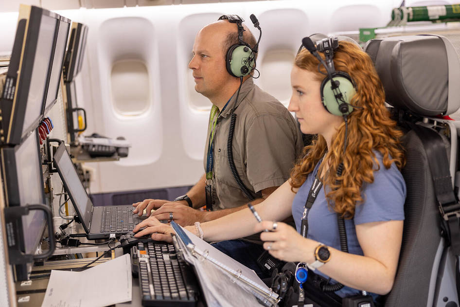 Two researchers monitor testing from inside the ecoDemonstrator