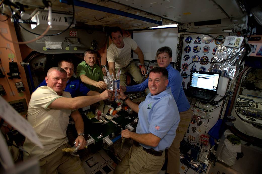 Expedition 50 crew members toast Thanksgiving