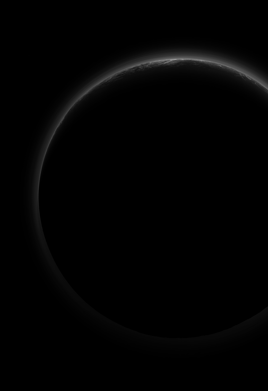 Sunlight filters through and illuminates Pluto’s complex atmospheric haze layers