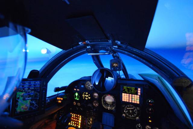 The instrument panel illuminates the cockpit of NASA's high-altitude ER-2 during a night mission over the eastern U.S. during th