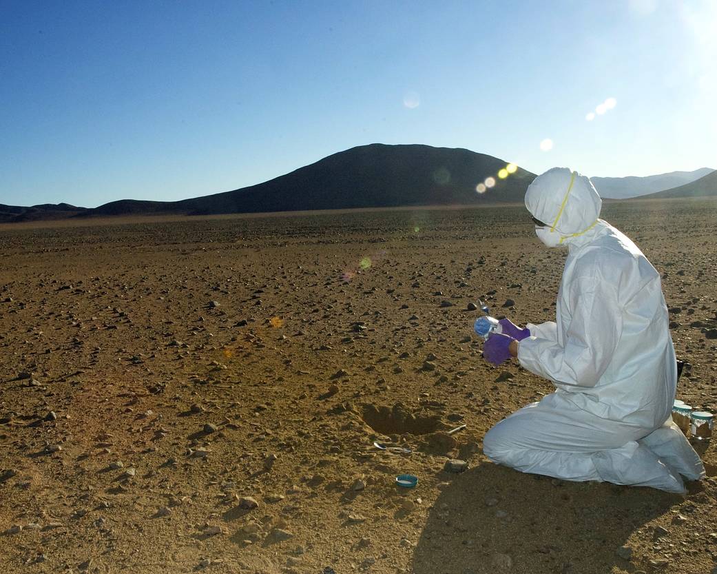 NASA scientist Mary Beth Wilhelm collects soil samples in Chile's  Atacama desert