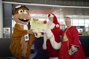 NASA Orville character meets Santa and Mrs. Santa.