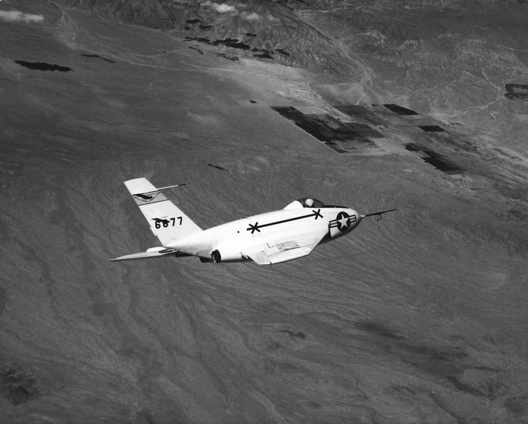 The NACA High-Speed Flight Research Station X-4 research aircraft is seen in this 1950s in-flight photograph flying near an appr
