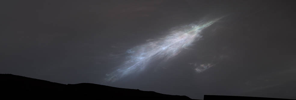 This feather-shaped iridescent cloud was captured just after sunset