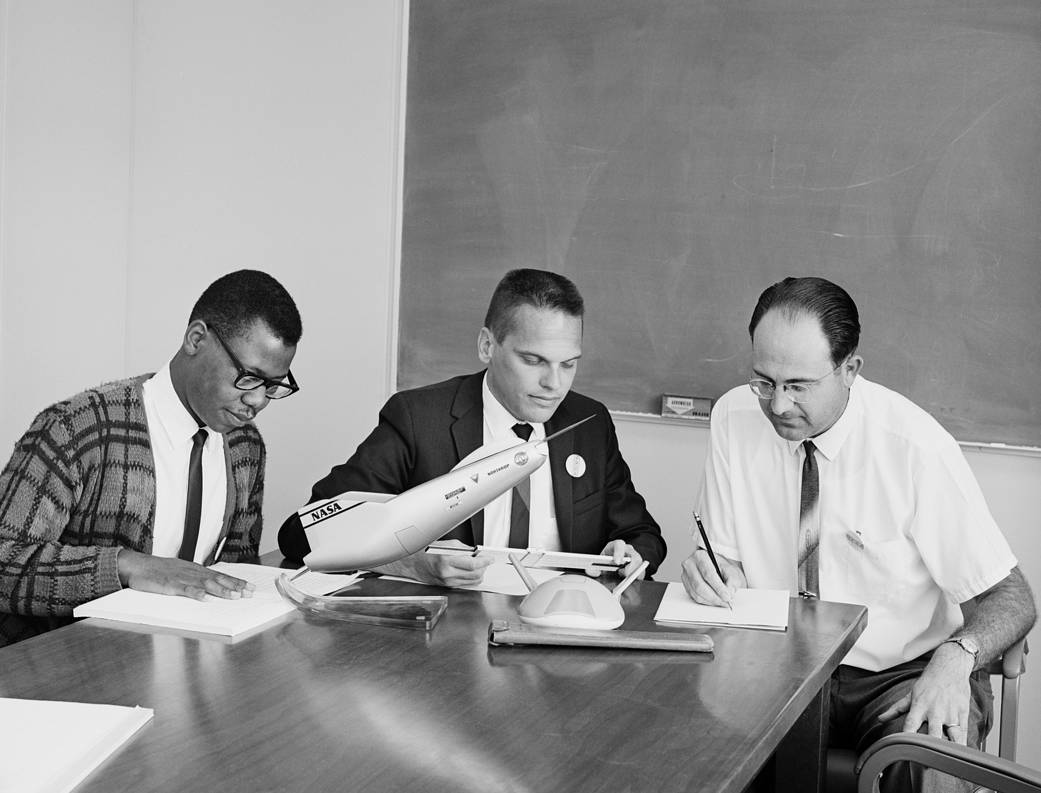 Ken Iliff, center, Dale Reed, right, and an unidentified man, were part of the center's lifting body aircraft study group.