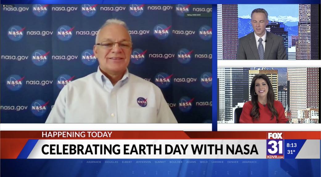 Three people doing a news interview