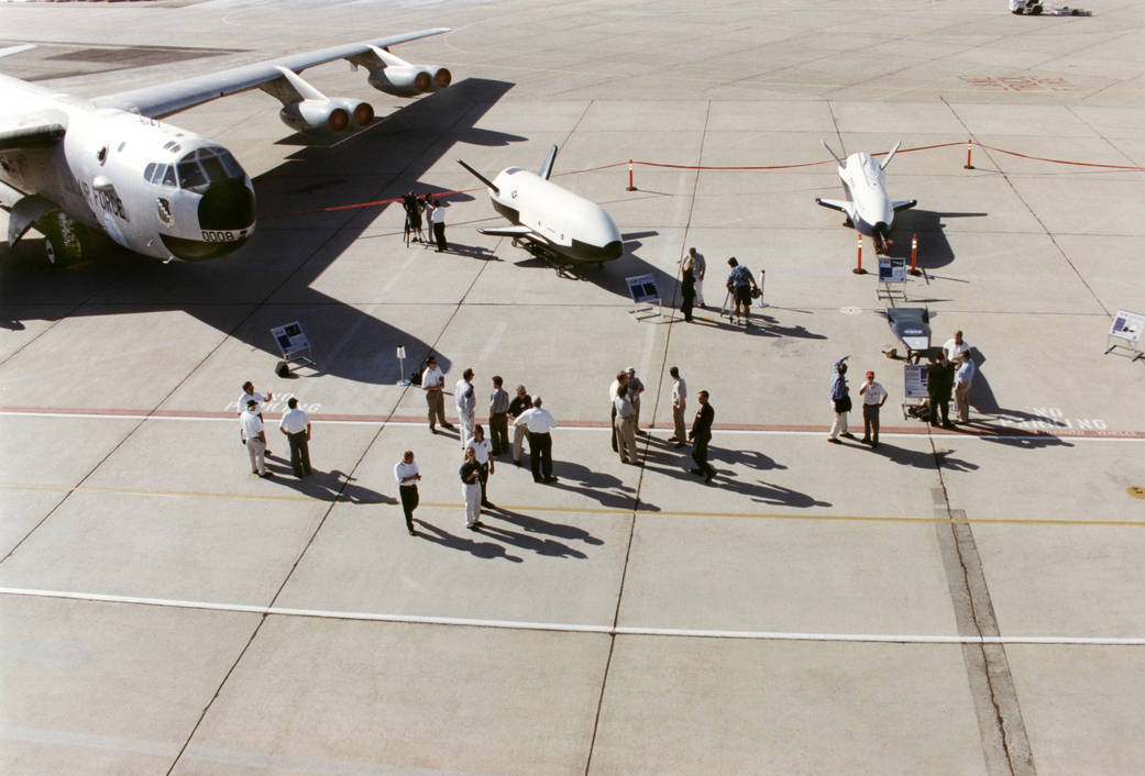 Aerospace industry representatives view actual and mock-up versions of 'X-Planes'.