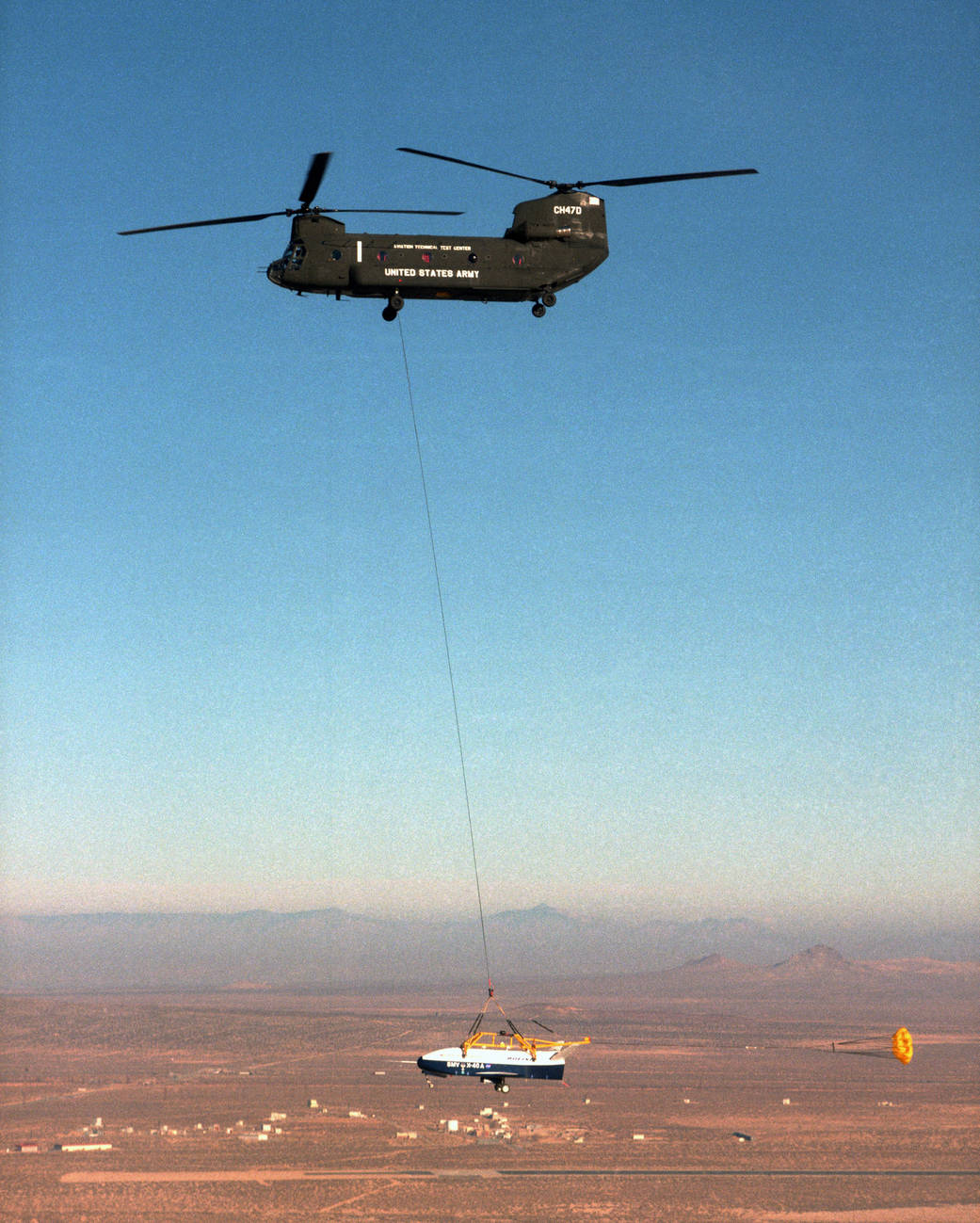 The X-40 sub-scale technology demonstrator is suspended under a U.S. Army CH-47 Chinook cargo helicopter.