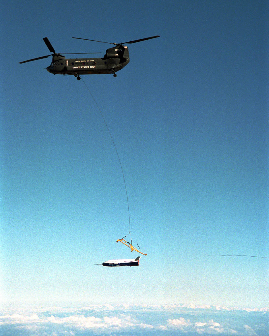 X-40A releasing from the strongback during Free Flight #2A. Both are attached by tether line to the CH-47.