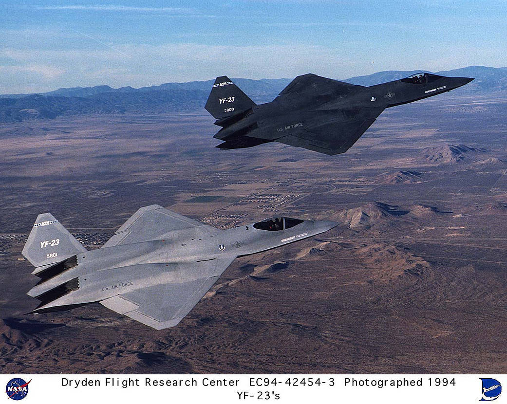 The two YF-23 prototype aircraft fly over the Mojave Desert prior to arrival at NASA's Dryden Flight Center, Edwards, California