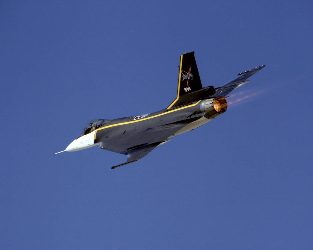 NASA's single-seat F-16XL tail number 849 is shown accelerating in full afterburner during a flight in 1995. 