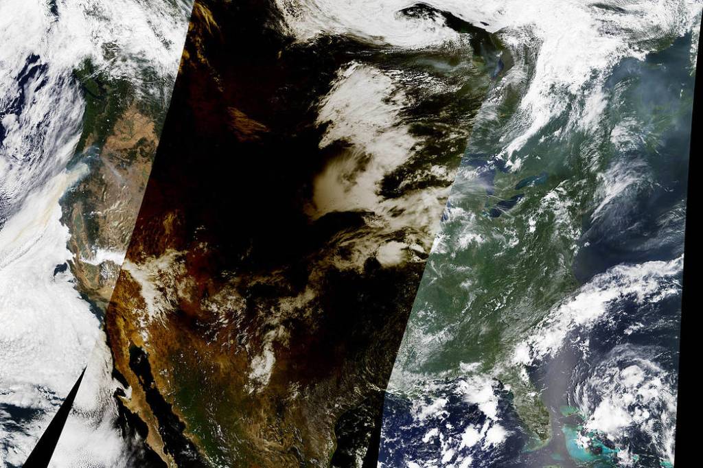 NASA Earth Observatory: Eclipse Shadow Darkens the United States