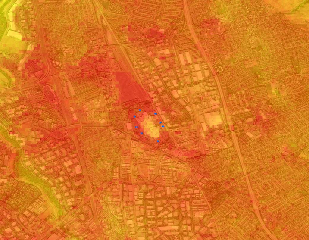 Heat map image with bright orange and yellow colors highlighting hot spots on the ground.