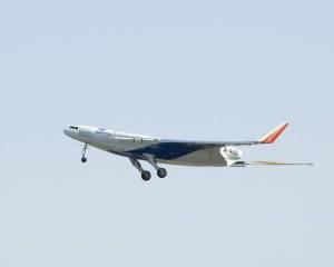 Boeing's remotely piloted X-48B Blended Wing Body aircraft in flight with the landing gears down.