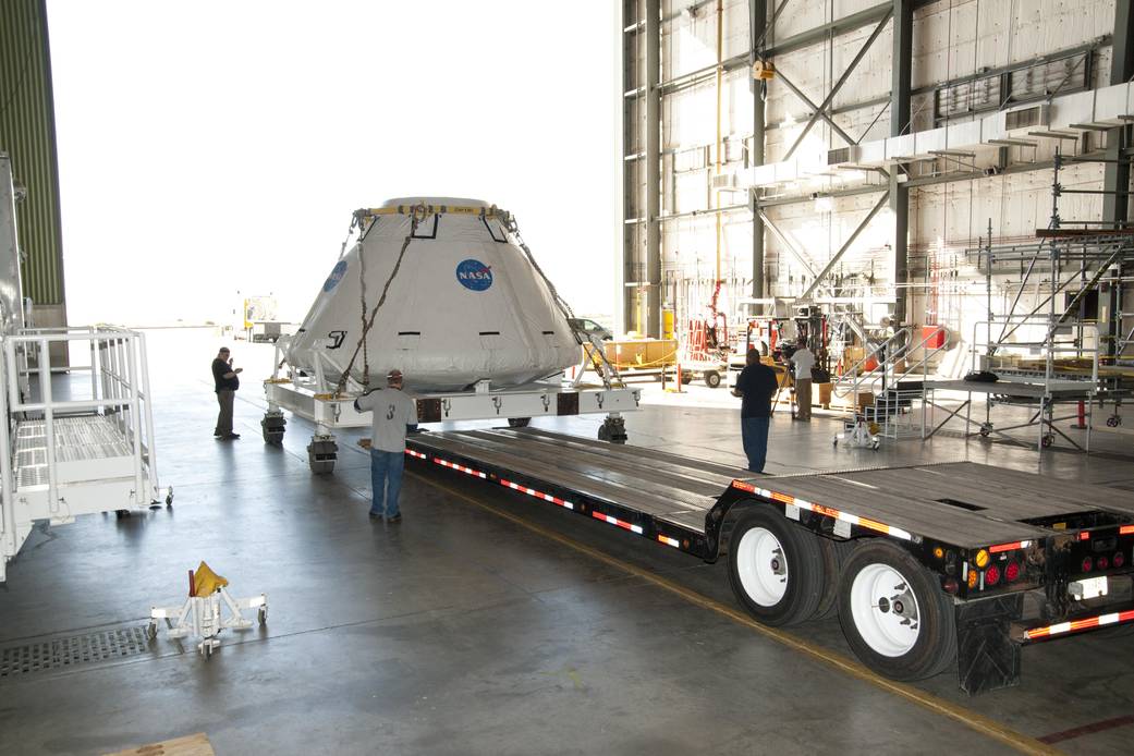 Prototype Capsule of Multi-Purpose Crew Vehicle Guided onto Lowboy Trailer