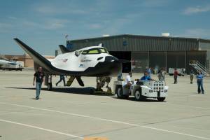 Sierra Nevada Corporation's Dream Chaser flight test vehicle is towed from its hangar at NASA's Dryden Flight Research Center in