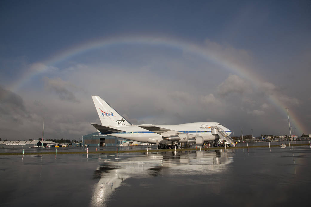 The NASA-DLR Stratospheric Observatory for Infrared Astronomy 747SP is framed by a spectacular rainbow following a winter storm 