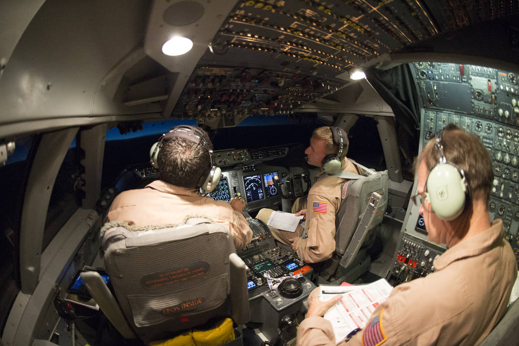 SOFIA flight crew Manny Antimisiaris, pilot-in-command (left), Jim Less, co-pilot (middle), and Marty Trout, flight engineer (ri