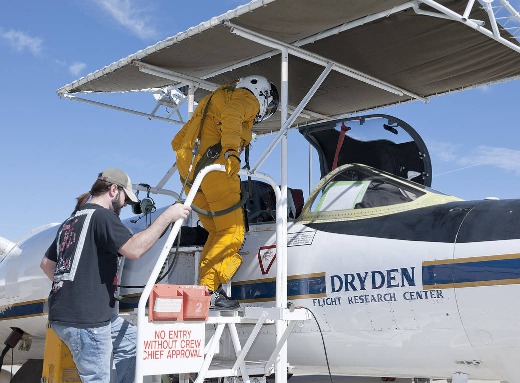 Life Support Technician Preps Pilot for SEAC4RS Mission