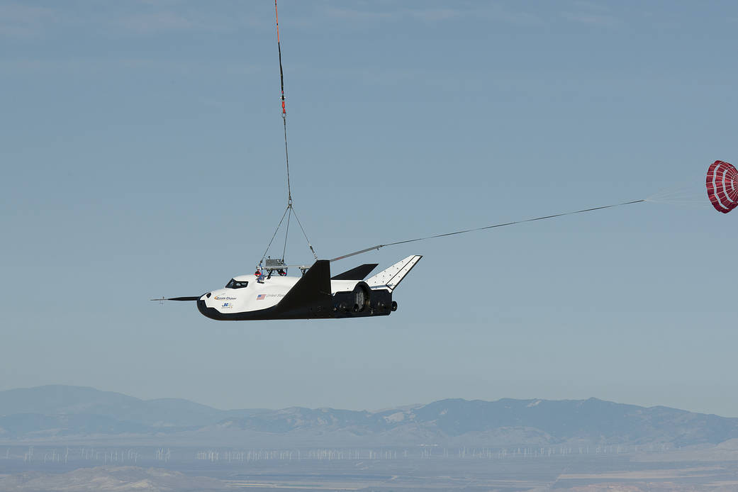 Sierra Nevada Corporation's Dream Chaser engineering test spacecraft is hoisted into the air during a captive carry test Aug.22 