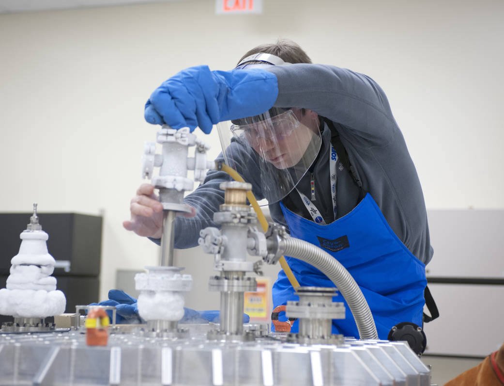 Christian Fischer checks the FIFI-LS that is cooled by liquid nitrogen and helium during testing. The University of Stuttgart 3D