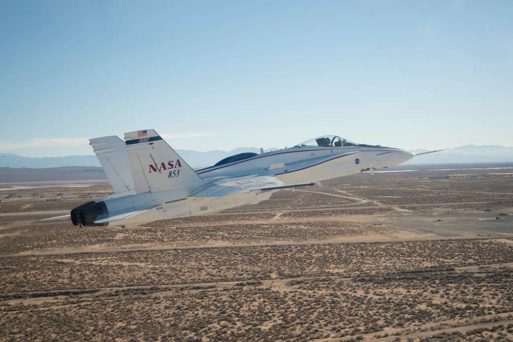 Adaptive Augmenting Controller Validated on F/A-18
