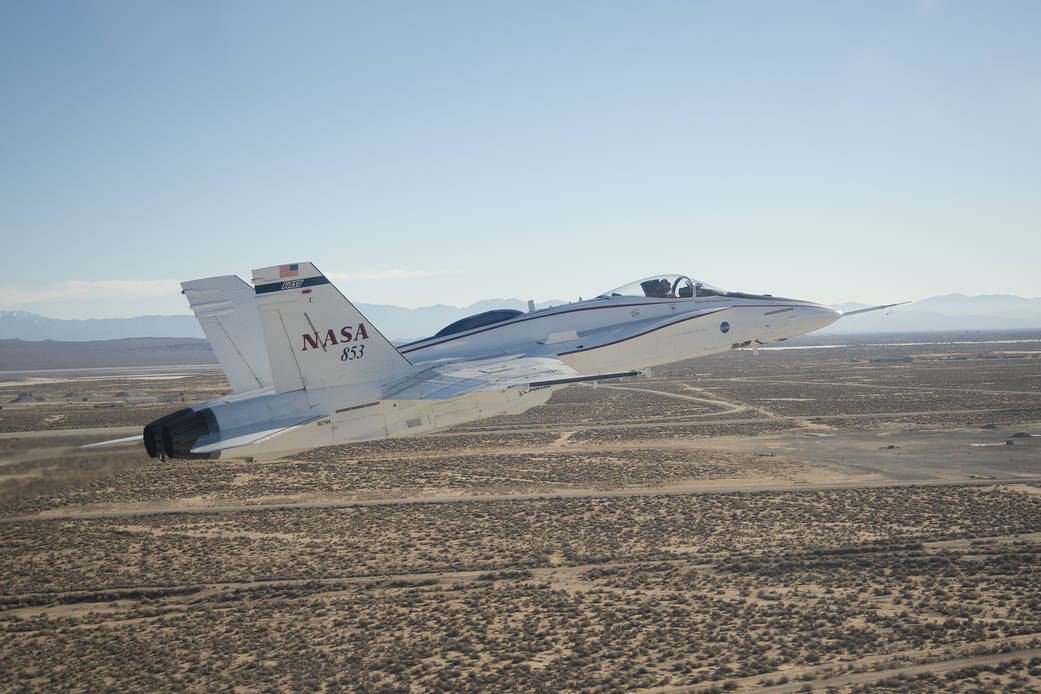 Adaptive Augmenting Controller Validated on F/A-18