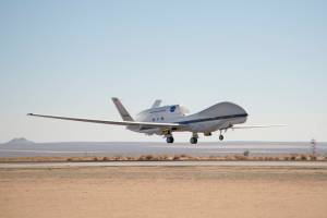 NASA's Global Hawk 872 takes to the air from the main runway at Edwards Air Force Base Dec. 20, 2013, during a checkout flight o