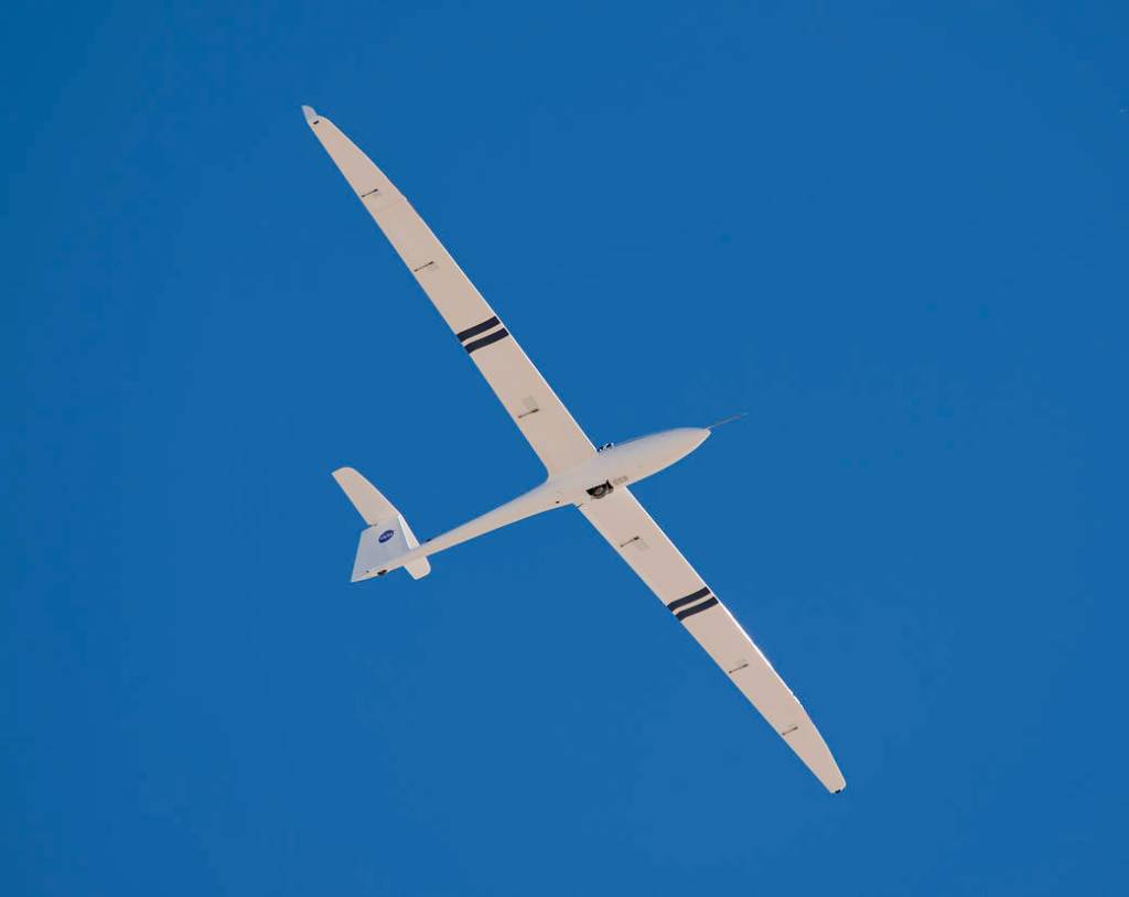 A 1/3-scale unmanned sailplane shows off its graceful high-aspect-ratio wing as it descends for landing during preliminary fligh