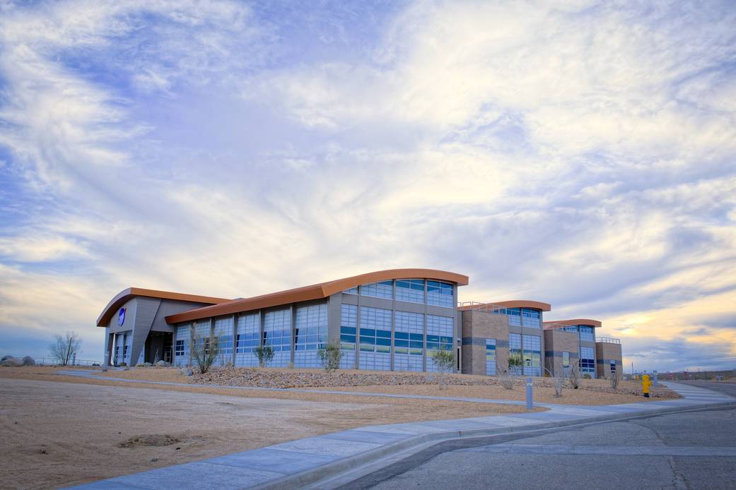 Large expanses of windows and curved rooflines highlight the northern sides of the new Facilities Support Center at NASA's Dryde