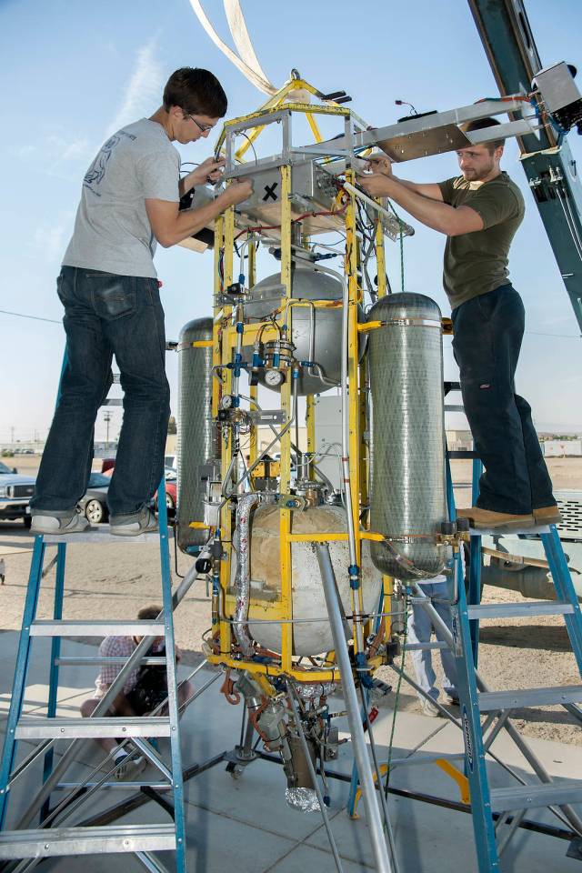 Technicians of Masten Space Systems complete installation of Astrobotic's autonomous landing system atop Masten's Xombie
