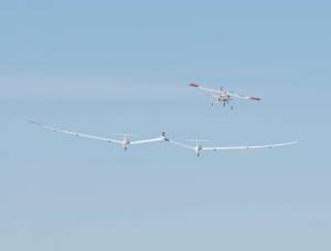 One of NASA Armstrong’s DROID small unmanned research aircraft tows the twin-fuselage towed glider.