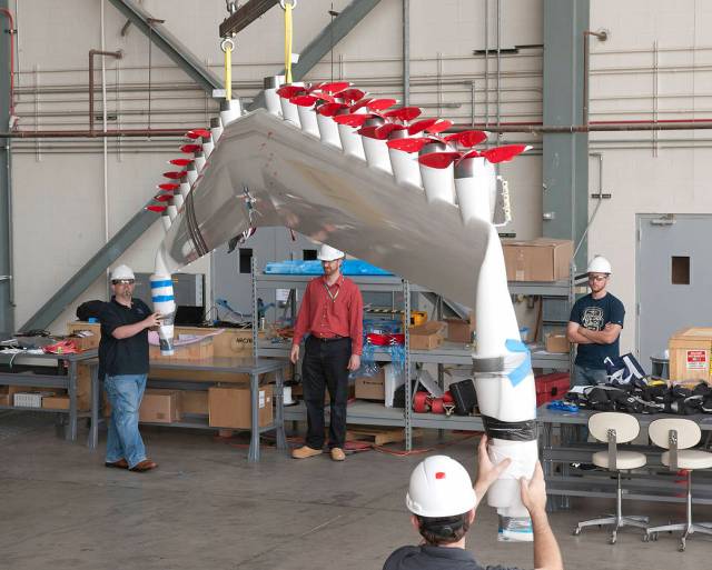 Engineers at NASA’s Armstrong Flight Research Center integrate electric propellers onto a modified wing.