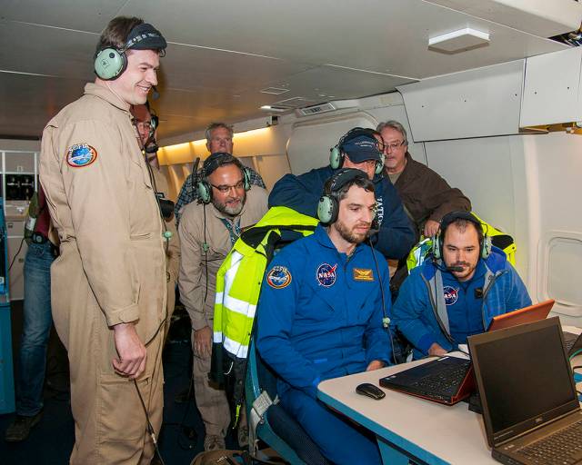 Scientists onboard SOFIA watch data come in from Pluto’s atmosphere.