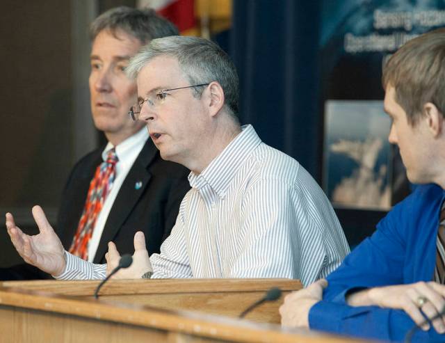 Gary Wick, center, answers a question from the media at NASA Armstrong.