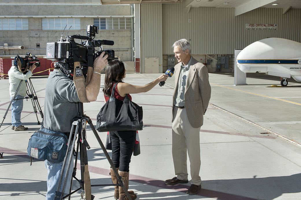 Frank Cutler, NASA Armstrong's Global Hawk project manager, talks to media about the Global Hawk and its current mission.