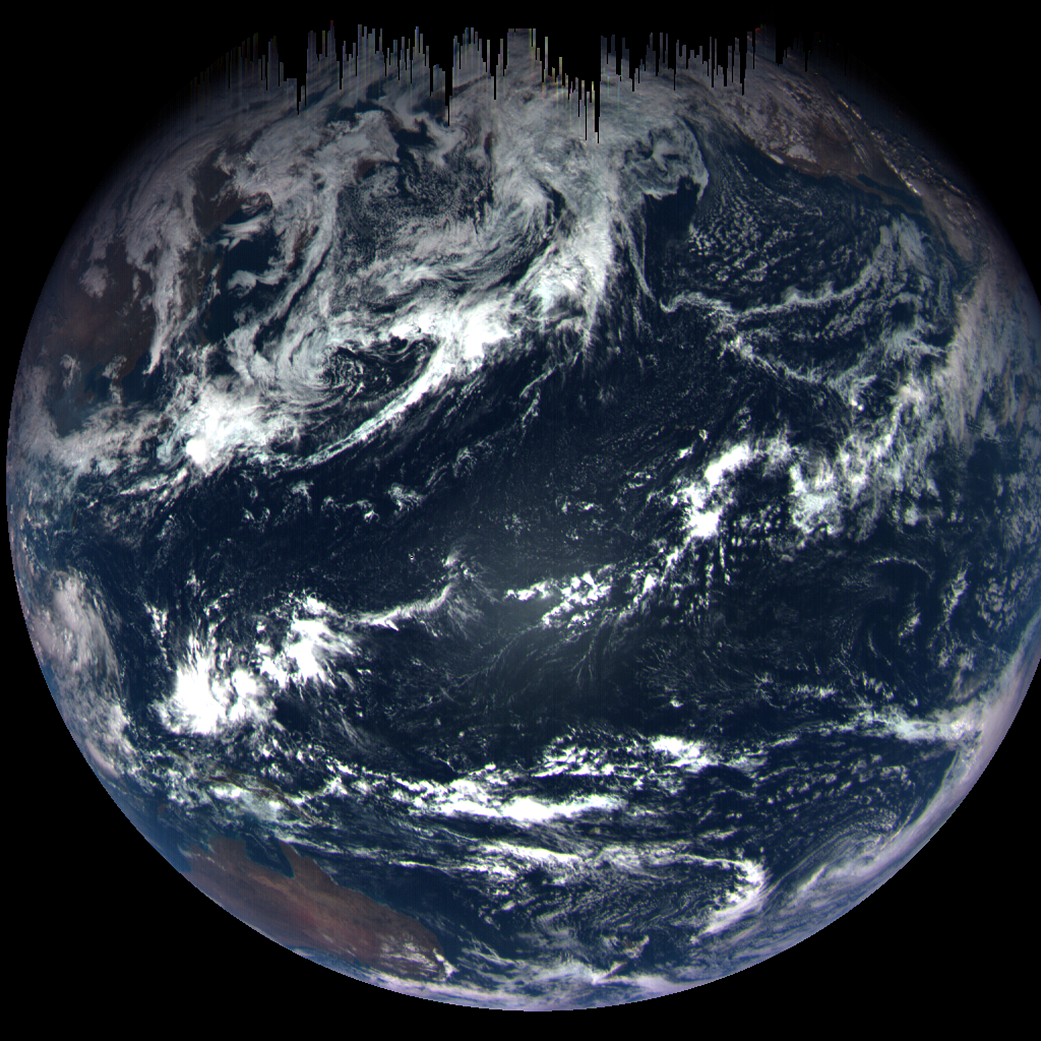 Earth from space with dark streaks in the north