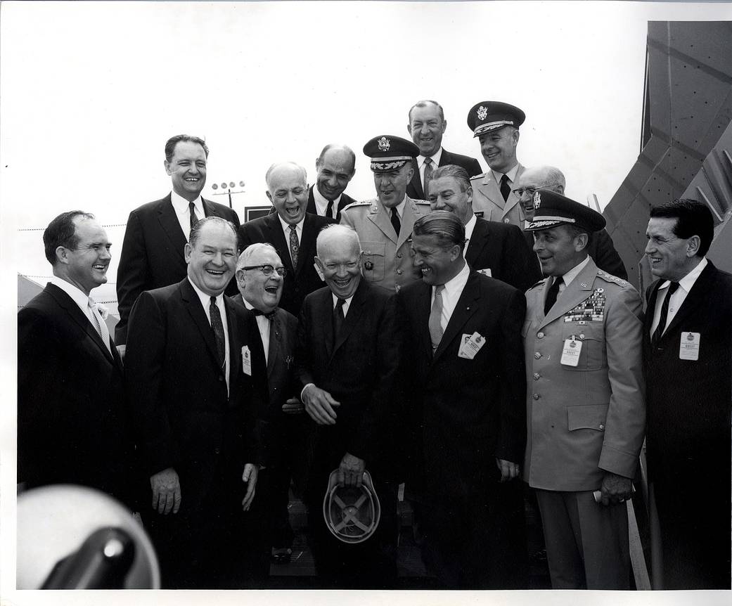 President Dwight D. Eisenhower and Dr. Wernher von Braun with various other dignitaries at the Redstone Arsenal airfield. 