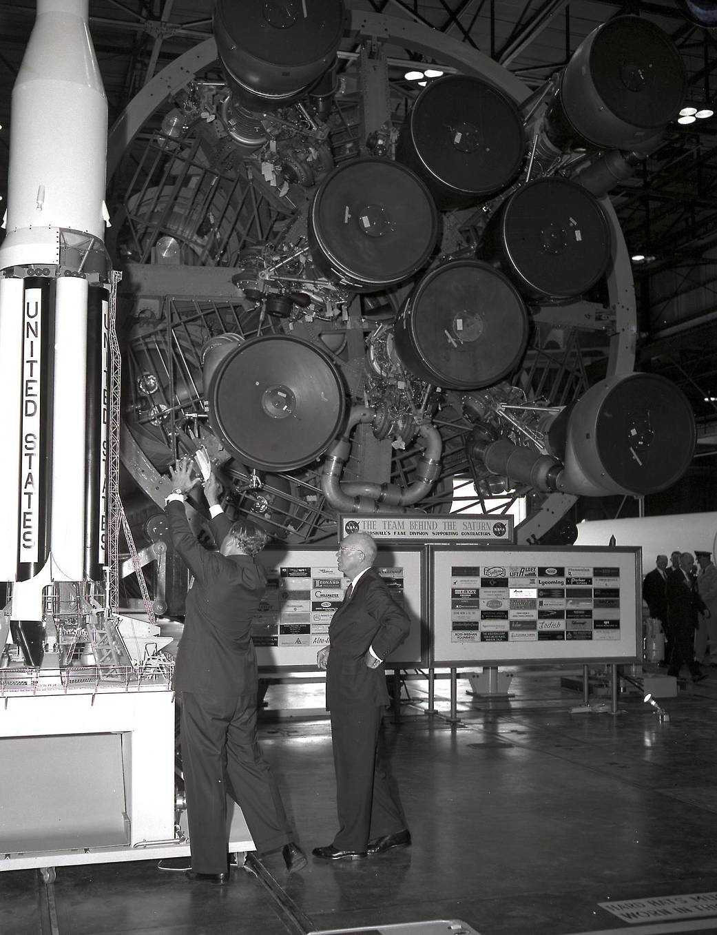 Dr. Wernher von Braun (left) briefs President Dwight D. Eisenhower at the front of the S-I Stage (first Stage) of the Saturn I.