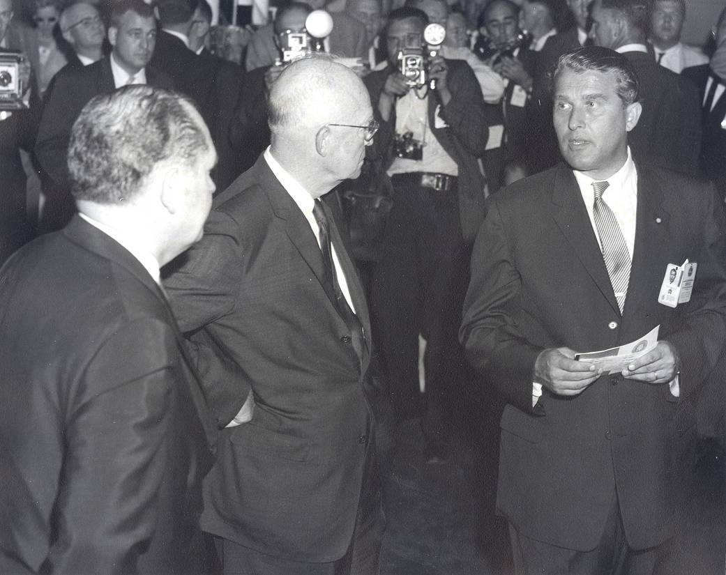 Dr. Wernher von Braun (right) briefs President Dwight D. Eisenhower (center) at Marshall with T. Keith Glennan (left).