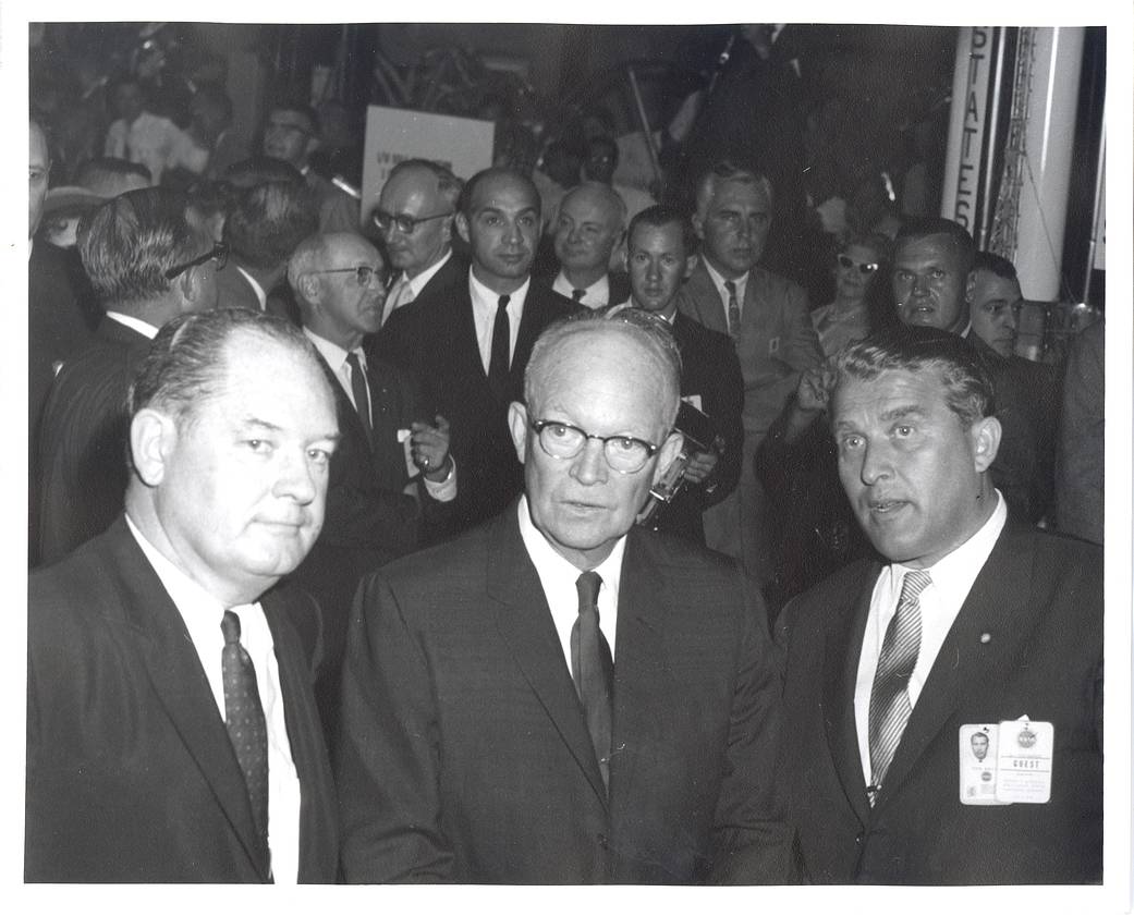 Dr. Wernher von Braun (right) briefs President Dwight D. Eisenhower (center) at Marshall with T. Keith Glennan (left)