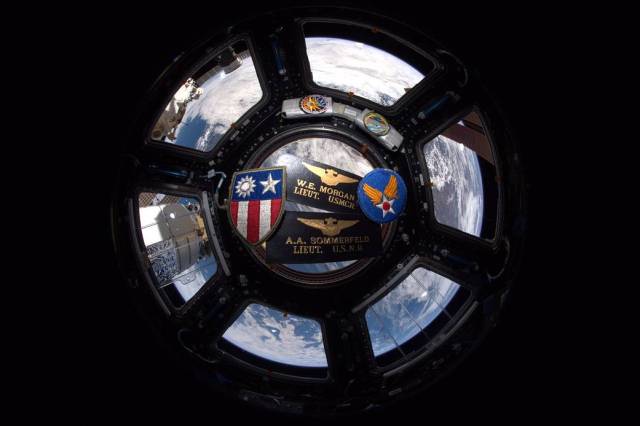 Military insignia and patches in the cupola of the International Space Station