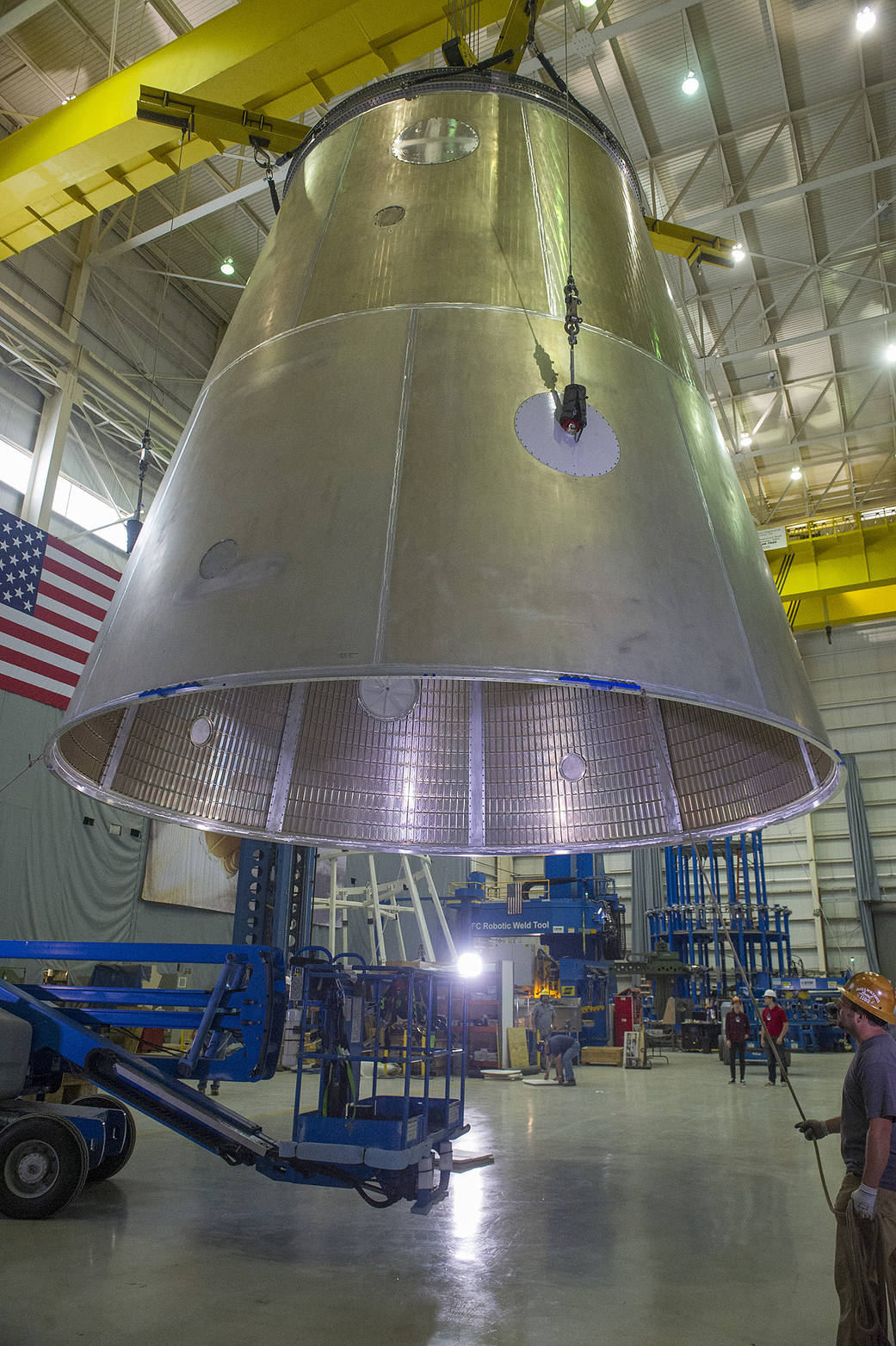A crane lifts the structural test article of the launch vehicle stage adapter (LVSA) 