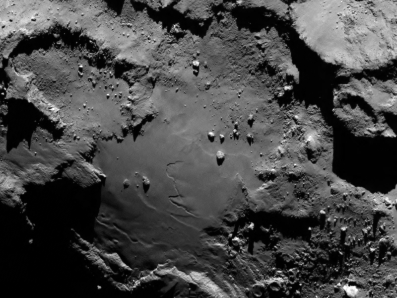 Close up detail focusing on a smooth region on the ‘base’ of the ‘body’ section of comet 67P/Churyumov-Gerasimenko. The 