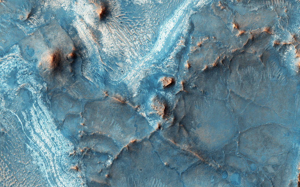 Colorful terrain on Mars surface with exposed bedrock