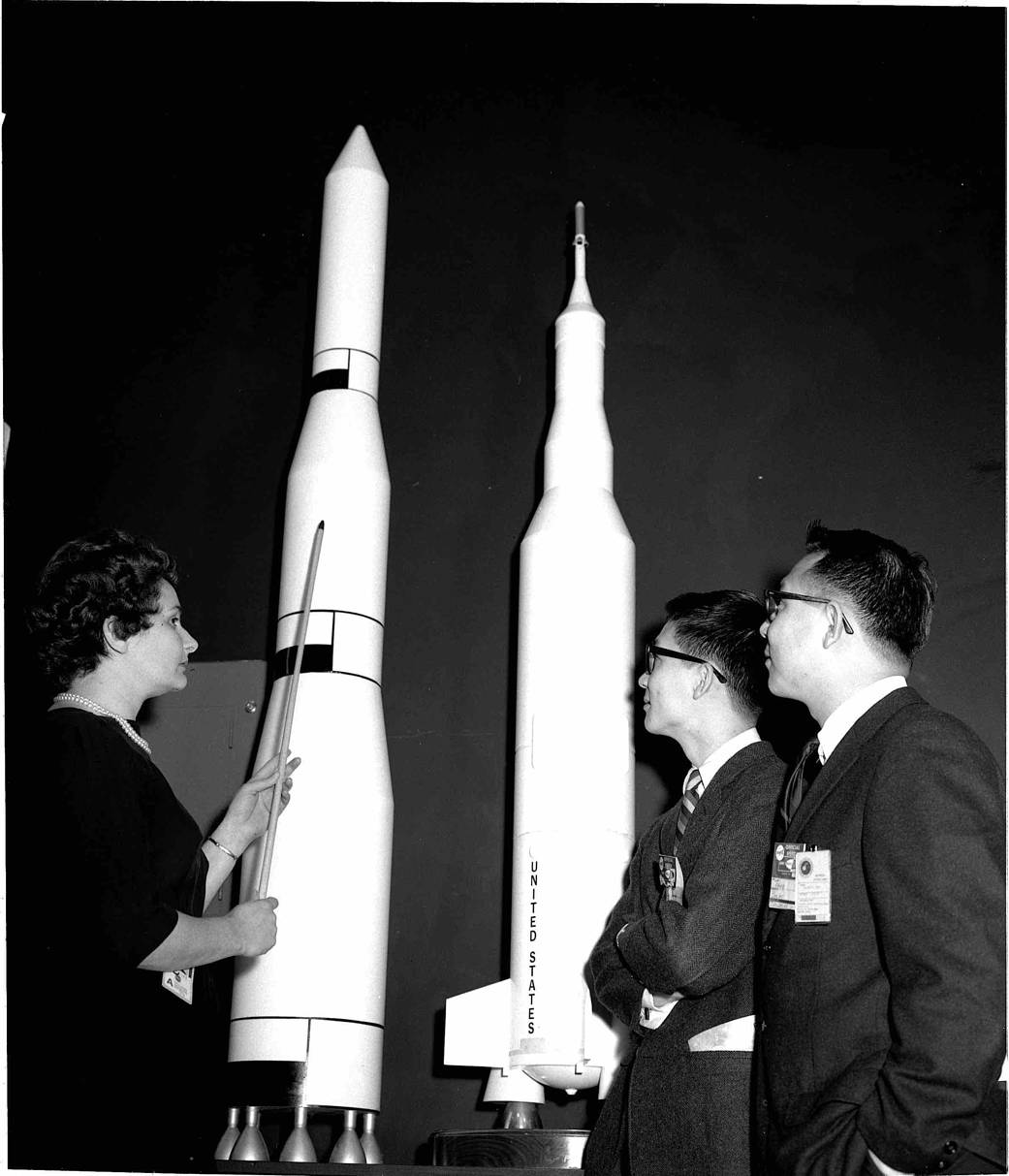 Evelyn Falkowski with Japanese visitors William Tung and Joseph Tung in the Space Orientation Center at Marshall.