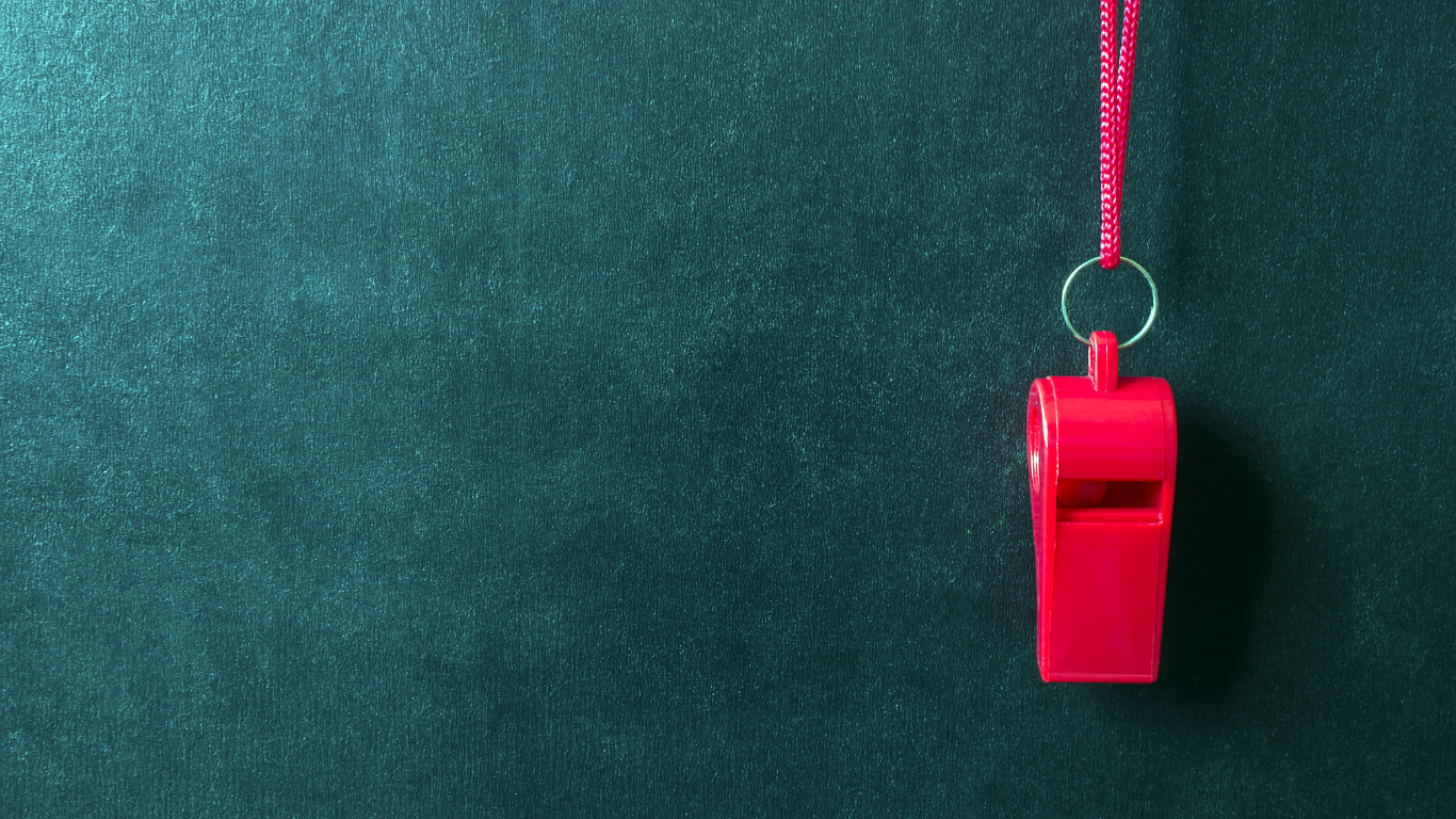 red whistle on green background