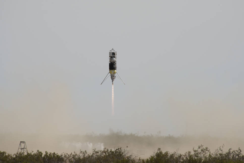 Rocket launching with a blue/gray sky in the background for Lunar Precision Landing testing.
